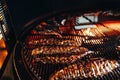 A top sirloin steak flame broiled on a barbecue, shallow depth of field