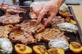 A top sirloin steak flame broiled on a barbecue, shallow depth of field.