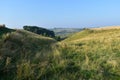 Top of small valley between fields