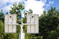 Top of street lamp post with solar panels and wind turbine. Royalty Free Stock Photo