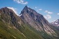 On top of the summit of Mount with incredible views of the Sunnmore Alps in Norway