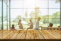 Top table with bokeh light blur restaurant. Wooden empty table in front of blurred background. Perspective wood plank over blur in Royalty Free Stock Photo