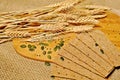 Top table of slices of healthy cereal bread with wheat decoration on wooden table background.