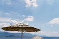 Top of a thatched beach umbrella against a blue sky Royalty Free Stock Photo