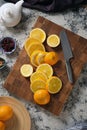 On top there are many sliced oranges on a beautiful wooden board Royalty Free Stock Photo