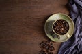 Top view above of Black coffee seed for morning menu in brown ceramic cup with coffee beans roasted Royalty Free Stock Photo