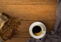 Top view above of Black hot coffee for morning with milk foam for morning menu in white ceramic cup with coffee beans roasted Royalty Free Stock Photo