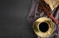 Top view above of Black hot fresh coffee in brown ceramic cup with coffee beans roasted Royalty Free Stock Photo