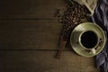 Black hot fresh coffee in brown ceramic cup with coffee beans roasted Royalty Free Stock Photo