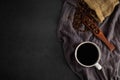 Black hot fresh coffee in a white ceramic cup with coffee beans roasted in burlap sack bag Royalty Free Stock Photo