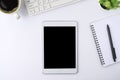 Top view above of tablet blank monitor black screen on white office desk table Royalty Free Stock Photo