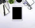 Top view above of tablet blank monitor black screen on white office desk table Royalty Free Stock Photo