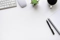 Top view above of White office desk table with keyboard, notebook and mouse computer with equipment other office supplies. Royalty Free Stock Photo