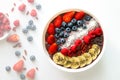 Acai Berry superfoods smoothies white bowl with chia seeds, strawberry, goji berry, coconut, blueberry, raspberry