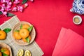 Top view accessories Chinese new year festival,leaf,wood basket,red packet,plum blossom Royalty Free Stock Photo