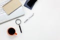 Top view accessories office desk concept.mobile phone,notepaper,pen,laptop,Magnifier on white office desk.