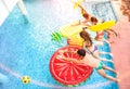 Top view of active friends jumping at swimming pool party - Vacation concept with happy guys and girls having fun in summer day Royalty Free Stock Photo