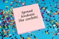Adhesive note with text spread kindness like confetti Royalty Free Stock Photo