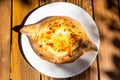 top view of Adjarian khachapuri illuminated by sun