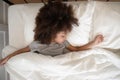 Top view adorable little african american kid girl sleeping alone. Royalty Free Stock Photo