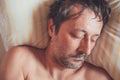 Top view of adult caucasian male sleeping in bed Royalty Free Stock Photo