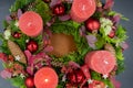 Top view of advent wreath with one red burning candle on gray background Royalty Free Stock Photo