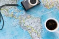 Top view of adventure flat lay with coffee cup and camera. Explore the new world or planing the vacation Royalty Free Stock Photo