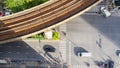 Top view aerial of a driving car on asphalt track and pedestrian crosswalk in traffic road with light and shadow silhouette with