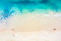 Top view aerial drone photo of ocean seashore with beautiful turquoise water, sea waves and people. Caribbean resort. Vacation