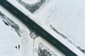 Top view aerial of empty asphalt road through countryside in winter Royalty Free Stock Photo