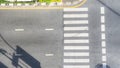 Top view aerial photo of asphalt track and pedestrian crosswalk in traffic road with light and shadow silhouette Royalty Free Stock Photo