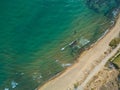 Top view aerial photo from flying drone of an amazing seascape with paradise beach and sea with turquoise water. Royalty Free Stock Photo