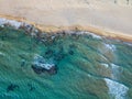 Top view aerial photo from flying drone of an amazing seascape with paradise beach and sea with turquoise water. Royalty Free Stock Photo