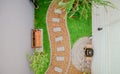 Top view aerial photo from flying drone of Stone walkway winding in garden Royalty Free Stock Photo