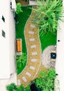 Top view aerial photo from flying drone of Stone walkway winding in garden Royalty Free Stock Photo