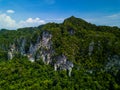 Top view aerial shot of beautiful green tropical mountains at early morning