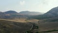 Top view or aerial shot of fresh green and yellow fields. Action. Top view of agricultural fields and mountains Royalty Free Stock Photo