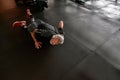 Aged man doing complicated push-ups in gym Royalty Free Stock Photo