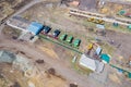 Top view on agricultural machinery near the hangar in the village for planting and harvesting. Tractor, plow, combine fuel truck