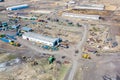 Top view on agricultural machinery near the hangar in the village for planting and harvesting. Tractor, plow, combine fuel truck