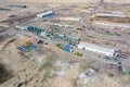 Top view on agricultural machinery near the hangar in the village for planting and harvesting. Tractor, plow, combine fuel truck