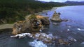 Top view of amazing cliffs of sea coast. Clip. Rocks with erosion of sea waves create amazing stone arches. Beautiful Royalty Free Stock Photo