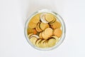 Top view amount euro coins in different price in trasparent bottle on white background. Buisiness and finance conept. Selective