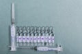 Top view of ampules, syringes on the blue table, empty space for text Royalty Free Stock Photo