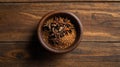 top view of anise seed ground in a small wooden plate ai generated Royalty Free Stock Photo