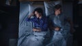 Top View Apartment: Happy Young Couple Sleeping in Bed at Night. Beautiful Girlfriend and Handsome Royalty Free Stock Photo