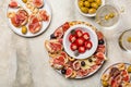 Top view of appetizers and vermouth cocktail. Bruschetta, cold cuts of prosciutto Royalty Free Stock Photo