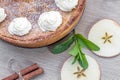 Top View on Apple Pie with Whipped Cream with Cinnamon, Mint and