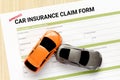 Top view of approved car insurance claim form with accident car Royalty Free Stock Photo