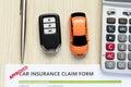 Top view of approved car insurance claim form with car key and c Royalty Free Stock Photo